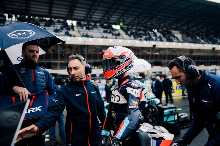 MLAV Racing rider and crew on the grid in the rain